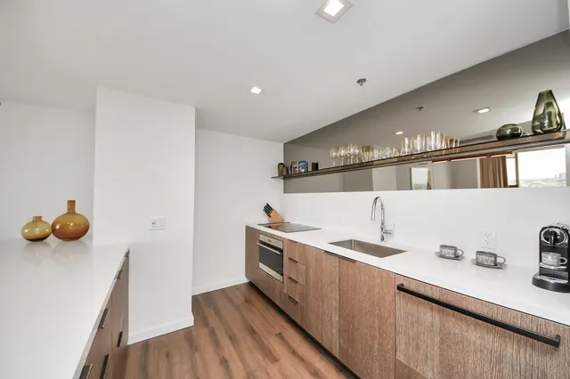 a kitchen with stainless steel appliances a sink and a stove