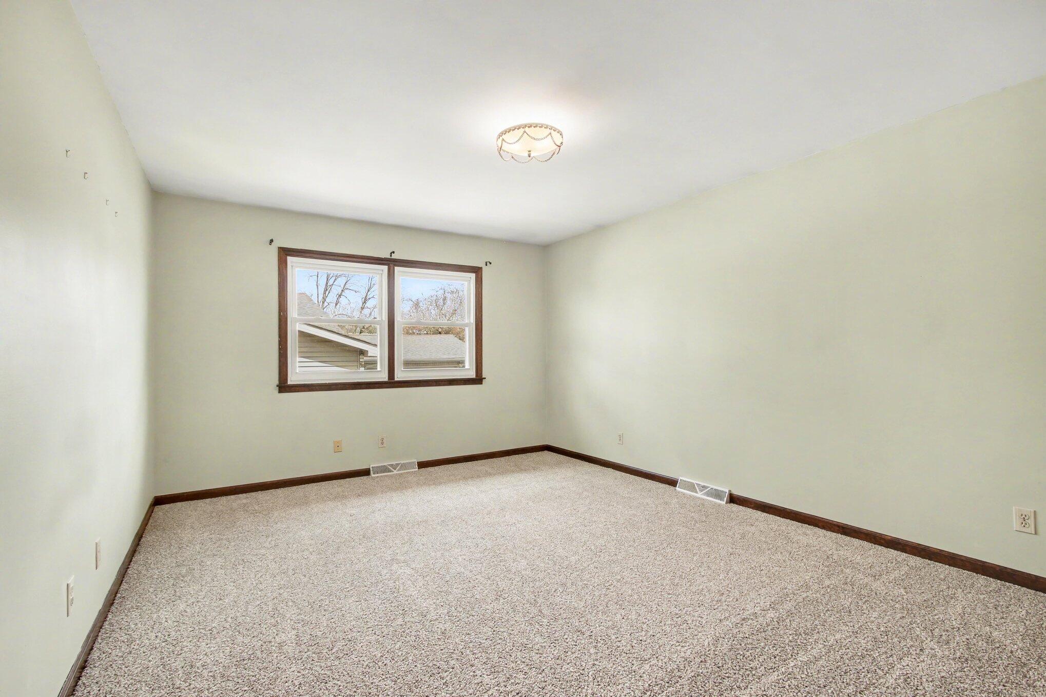 1379 Leeward Road Crown Point, IN 46307 - Photo 16 of 39 an empty room with windows