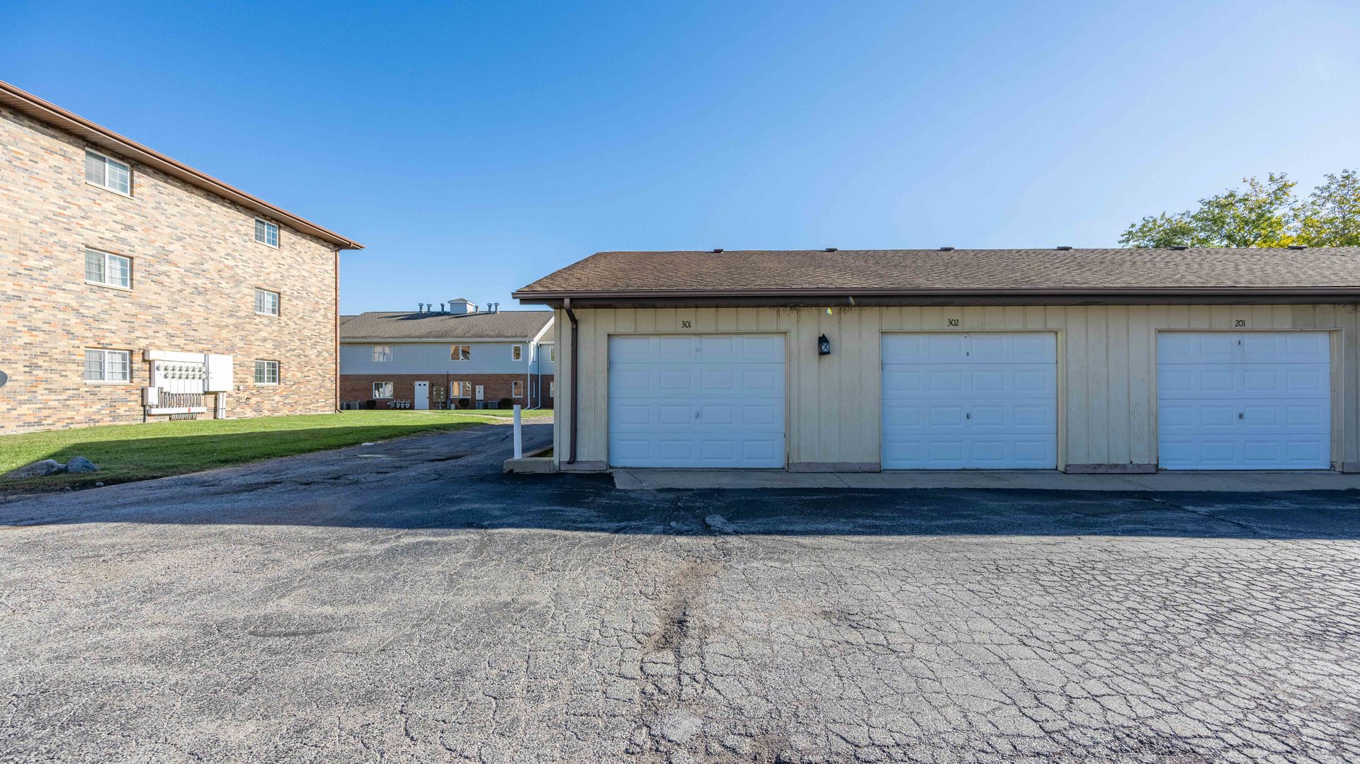 1234 Chalet Road, Unit 301 Naperville, IL 60563 - Photo 18 of 18 a front view of a house with a yard
