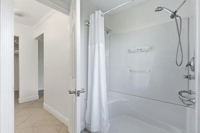 a bedroom with a bed and a sink