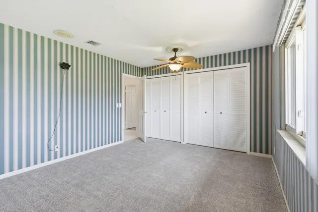 a view of a house with porch and a garden