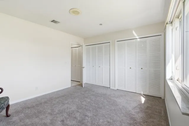 a view of a pathway of a house with a yard