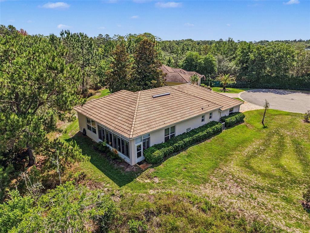 8910 Jericho Road Weeki Wachee, FL 34613 - Photo 3 of 52 a view of a house with a yard