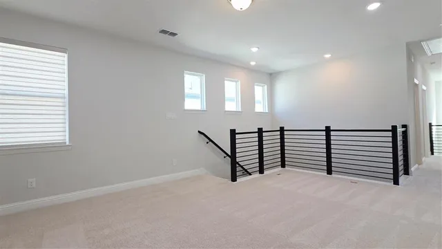 a view of a room with stairs and a window