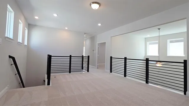 a view of a hallway with stairs