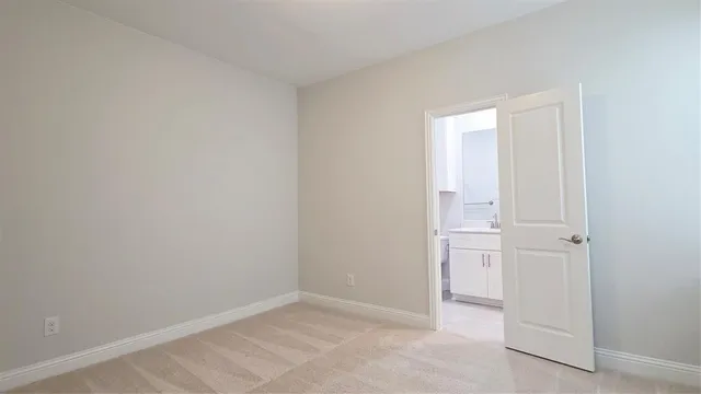 an empty room with white door