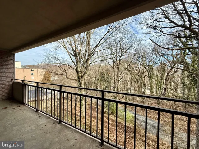 a view of a balcony with a pot