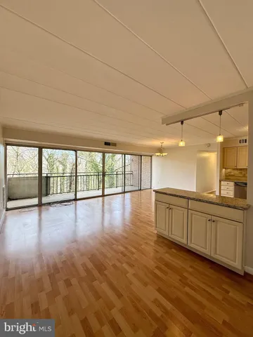 a view of a livingroom with wooden floor