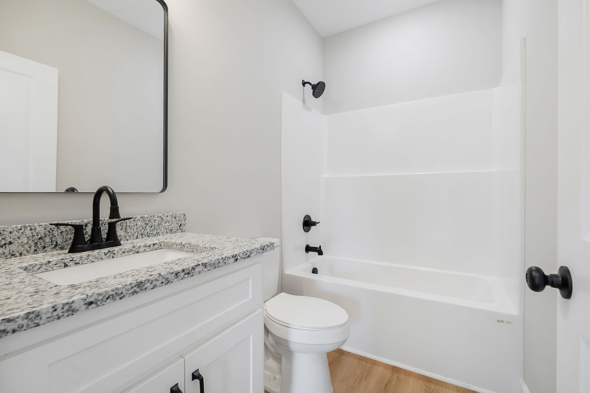 125 Reece Road Baxter, TN 38544 - Photo 25 of 31 a bathroom with a granite countertop sink toilet and shower