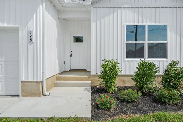 a house with trees in front of it