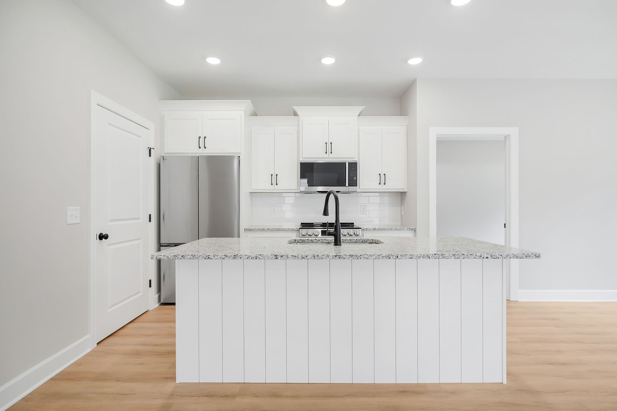 125 Reece Road Baxter, TN 38544 - Photo 4 of 31 a kitchen with stainless steel appliances granite countertop a sink a refrigerator and a granite counter tops