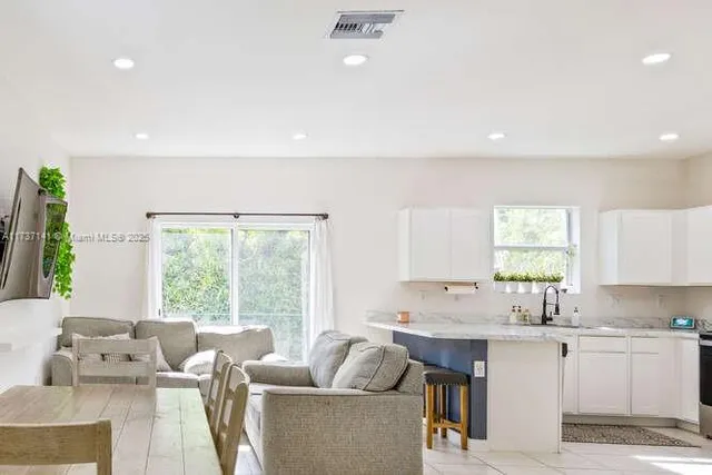 a living room with furniture and windows