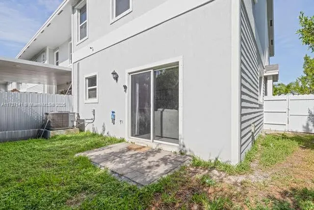 a view of a back yard of the house