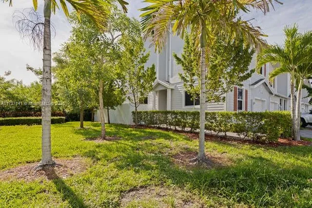 front view of a house with a yard
