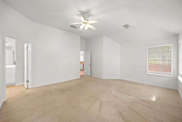 a spacious bathroom with a double vanity sink a bathtub a mirror and vanity