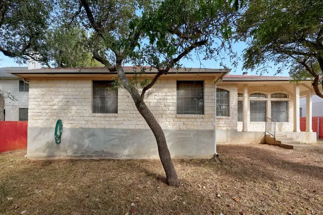 a backyard of a house with trees