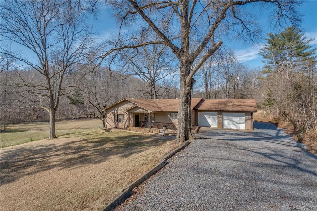 1014 South Main Street Rutherfordton, NC 28139 - Photo 1 of 31 a front view of a house with a yard and large trees