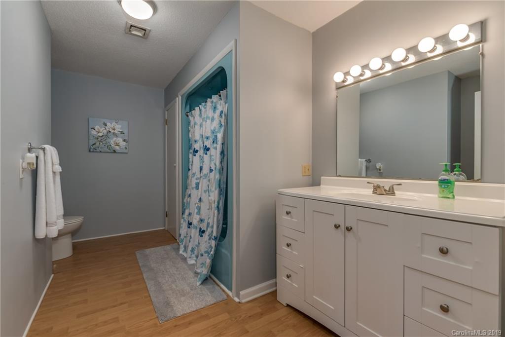 1014 South Main Street Rutherfordton, NC 28139 - Photo 17 of 31 a bathroom with a double vanity sink and mirror