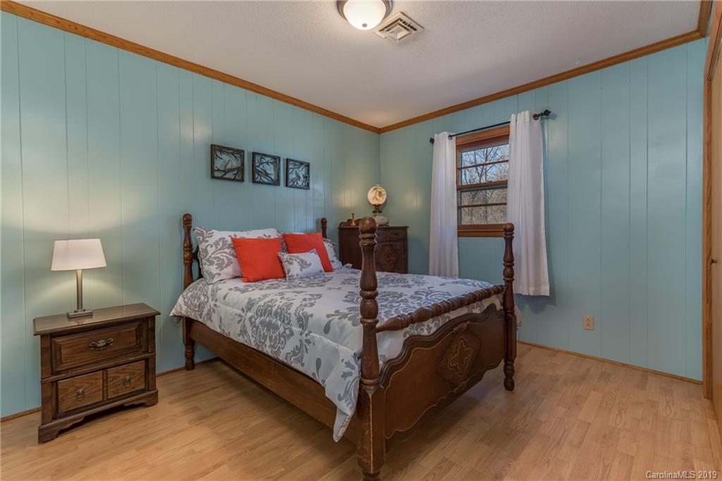 1014 South Main Street Rutherfordton, NC 28139 - Photo 18 of 31 a bedroom with a bed and a night stand
