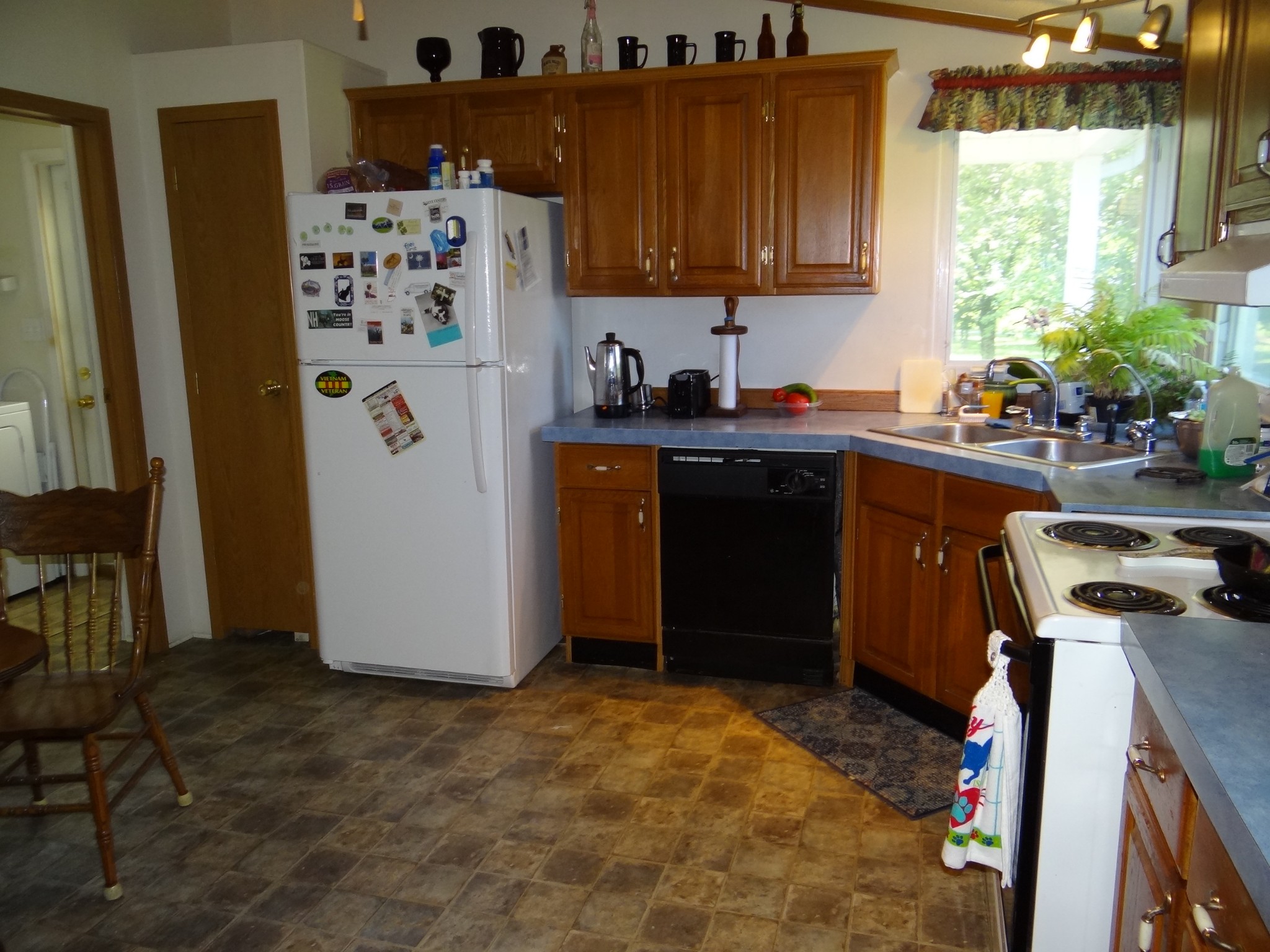 8493 Mulberry Road Baxter, TN 38544 - Photo 3 of 26 a kitchen with stainless steel appliances a refrigerator a sink a stove and a refrigerator
