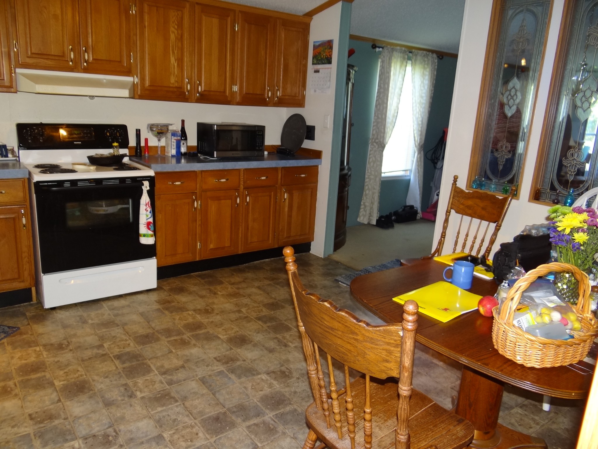 8493 Mulberry Road Baxter, TN 38544 - Photo 5 of 26 a kitchen with stainless steel appliances granite countertop a stove a sink dishwasher and cabinets with wooden floor