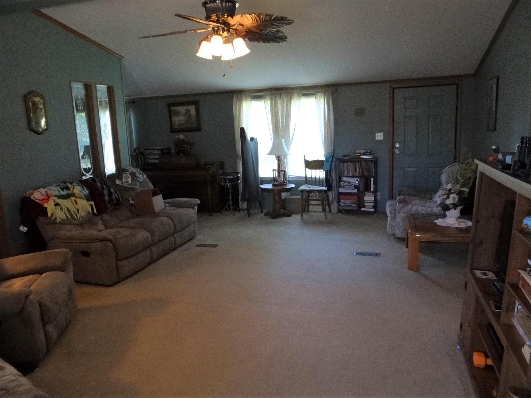 8493 Mulberry Road Baxter, TN 38544 - Photo 8 of 26 a living room with furniture and a chandelier