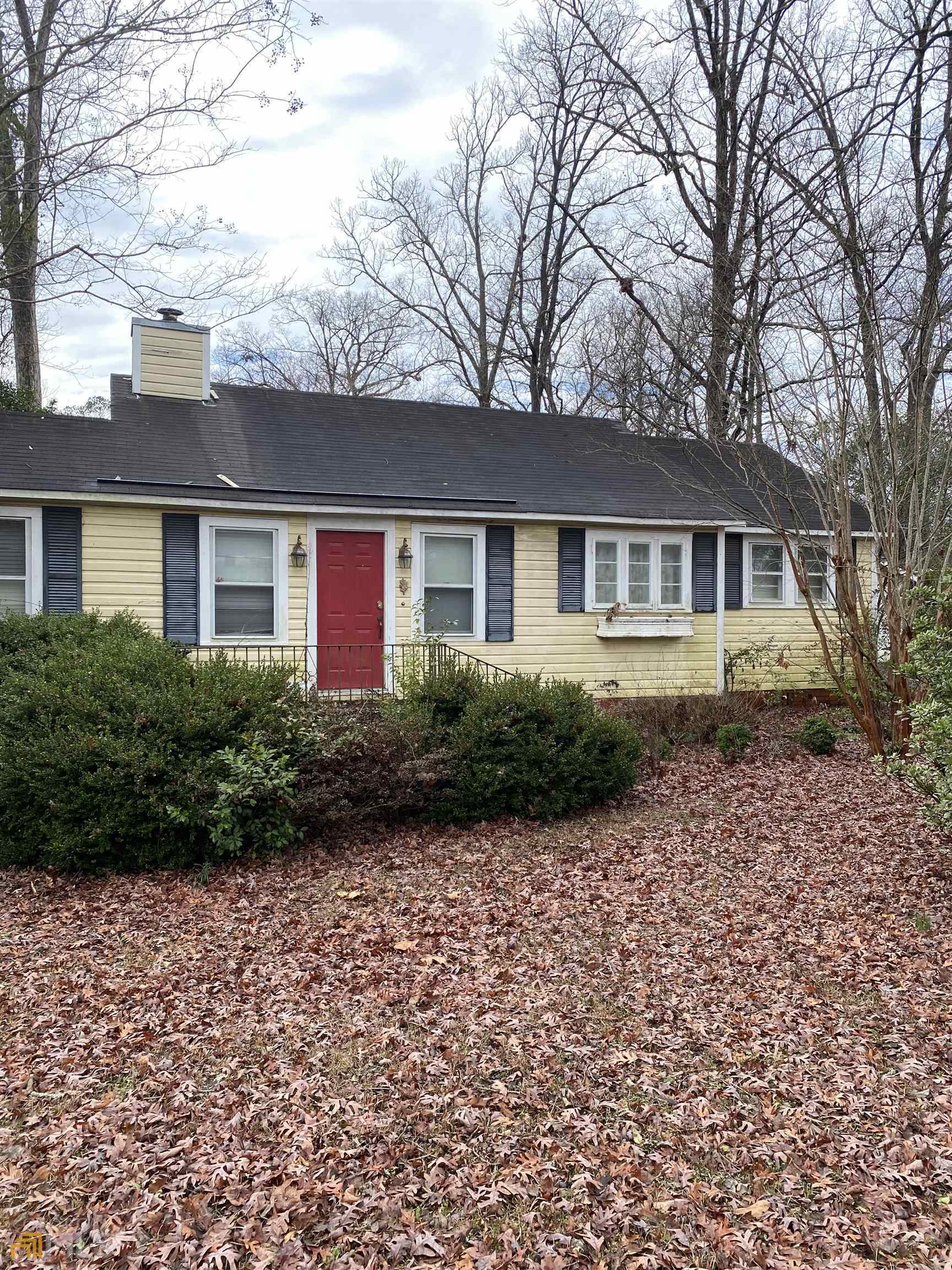 154 Stewart Avenue Gray, GA 31032 - Photo 1 of 1 a front view of a house with a garden