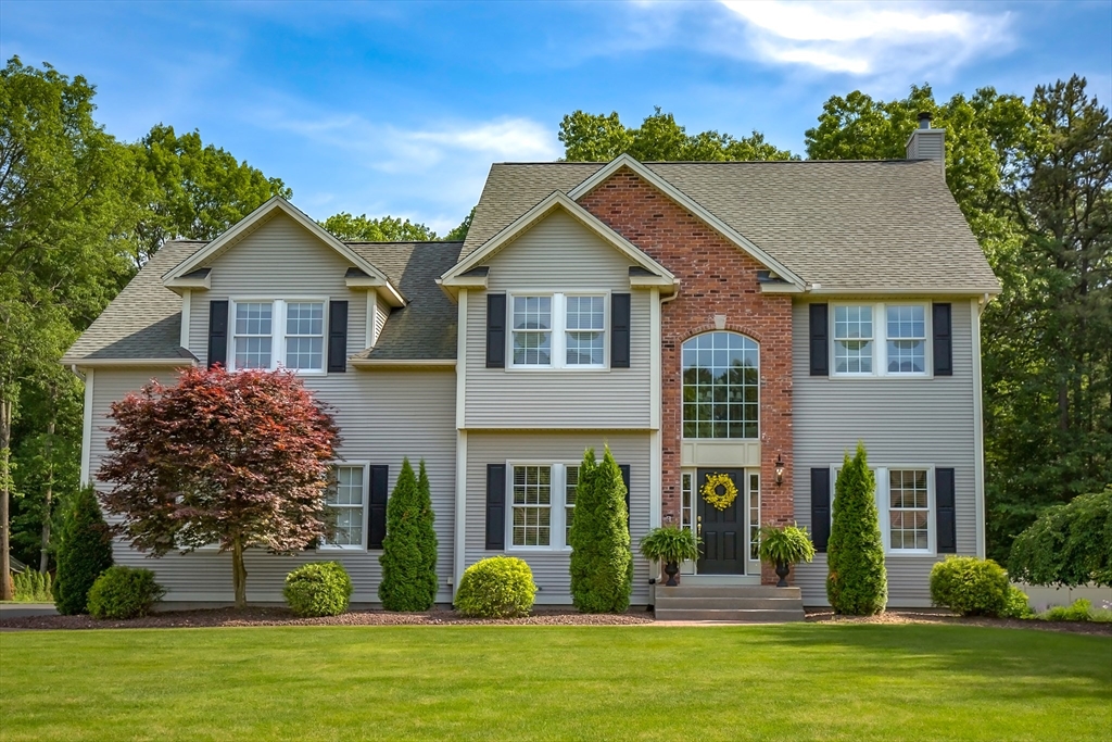 front view of a house with a yard