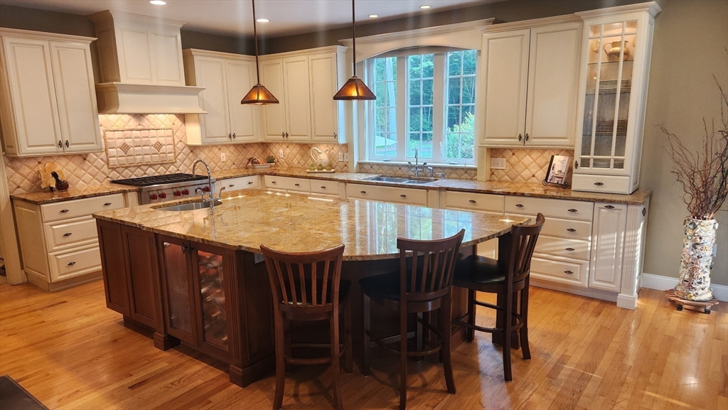 41 Christopher Drive Westfield, MA 01085 - Photo 11 of 42 a kitchen with stainless steel appliances granite countertop a stove a sink and a wooden cabinets