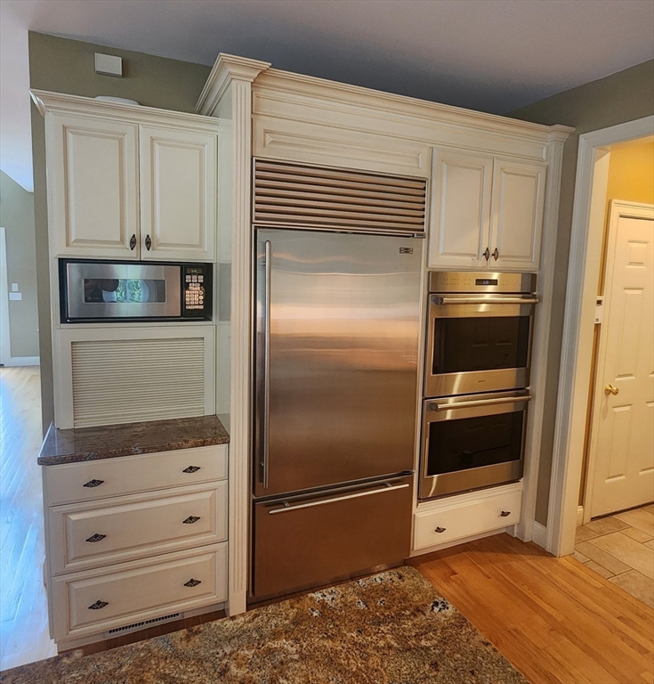 41 Christopher Drive Westfield, MA 01085 - Photo 15 of 42 a kitchen with white cabinets and stainless steel appliances