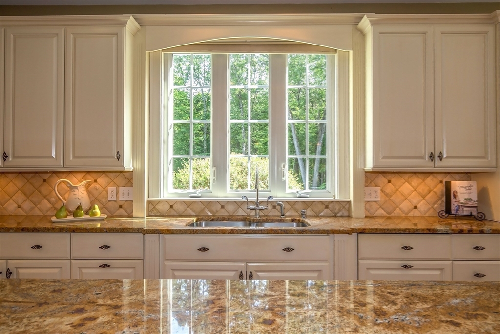 41 Christopher Drive Westfield, MA 01085 - Photo 16 of 42 a view of kitchen with granite countertop cabinets and window