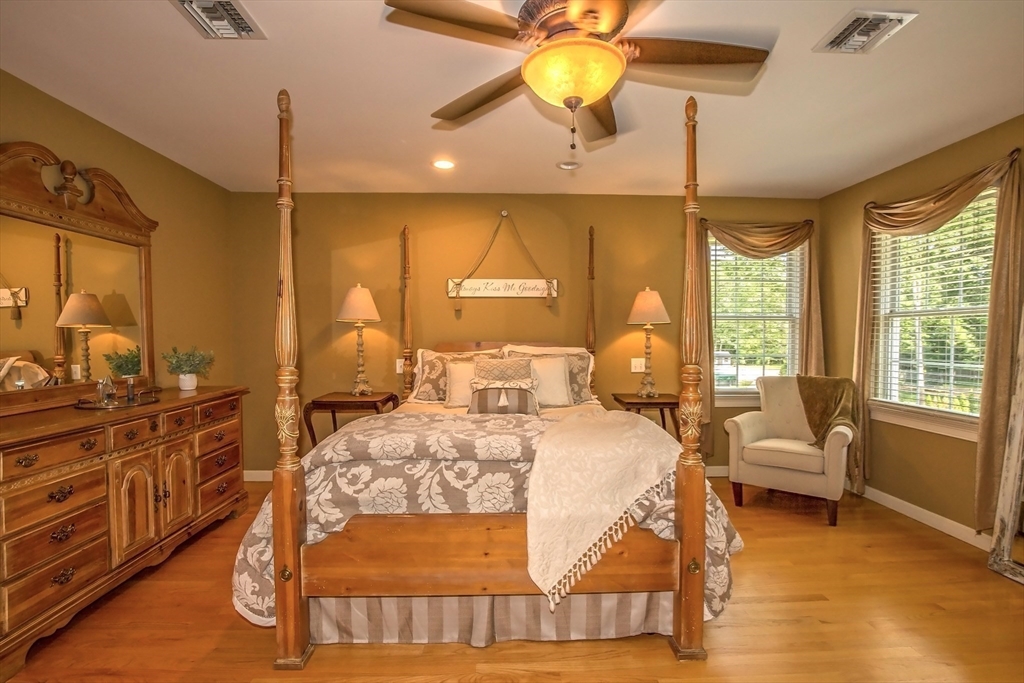 41 Christopher Drive Westfield, MA 01085 - Photo 19 of 42 a bedroom with a bed and wooden floor