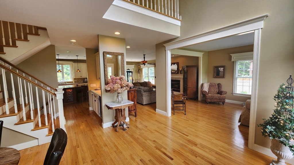 41 Christopher Drive Westfield, MA 01085 - Photo 5 of 42 a living room with furniture a wooden floor and a large window