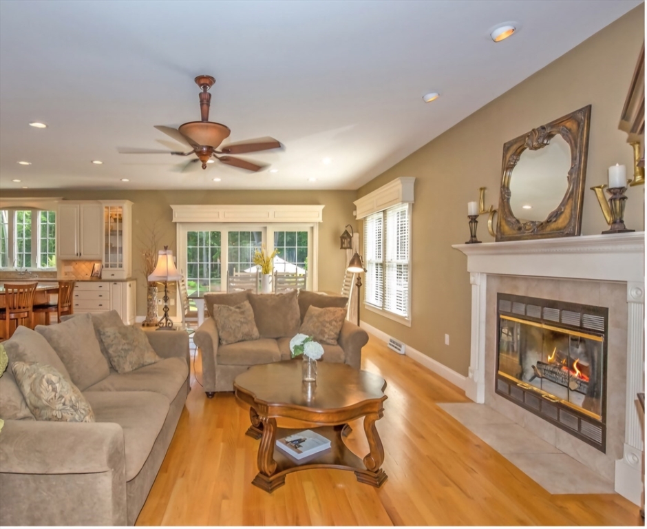 41 Christopher Drive Westfield, MA 01085 - Photo 8 of 42 a living room with furniture a fireplace and a chandelier