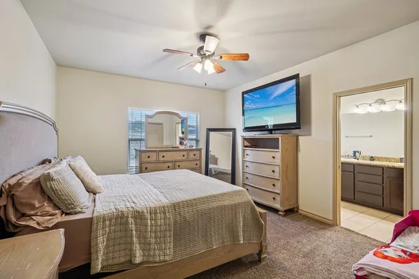 a bedroom with a bed and furniture