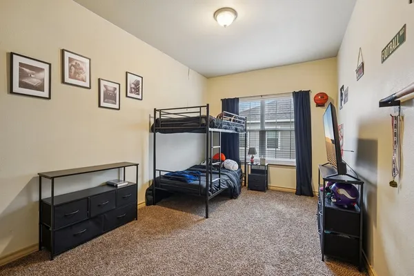 a bedroom with furniture and a bed