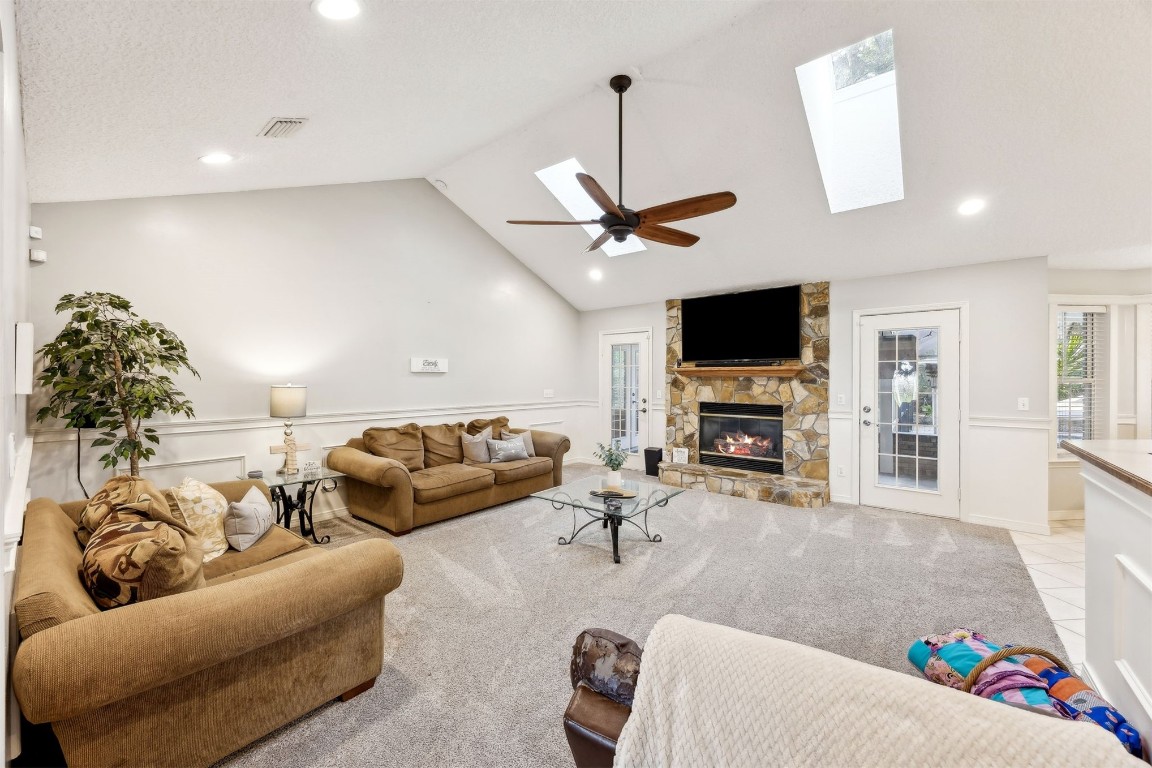 97535 Pirates Point Road Yulee, FL 32097 - Photo 17 of 59 a living room with furniture and a flat screen tv