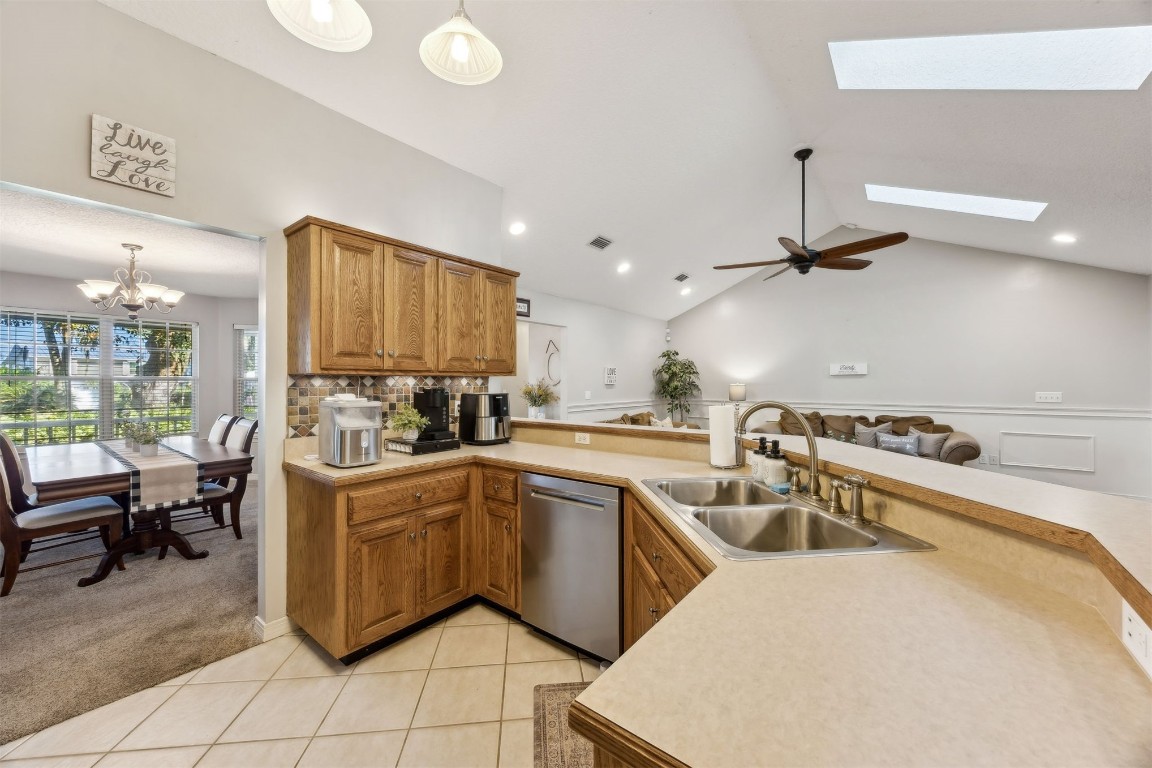 97535 Pirates Point Road Yulee, FL 32097 - Photo 20 of 59 a kitchen that has a sink and a stove with wooden floor