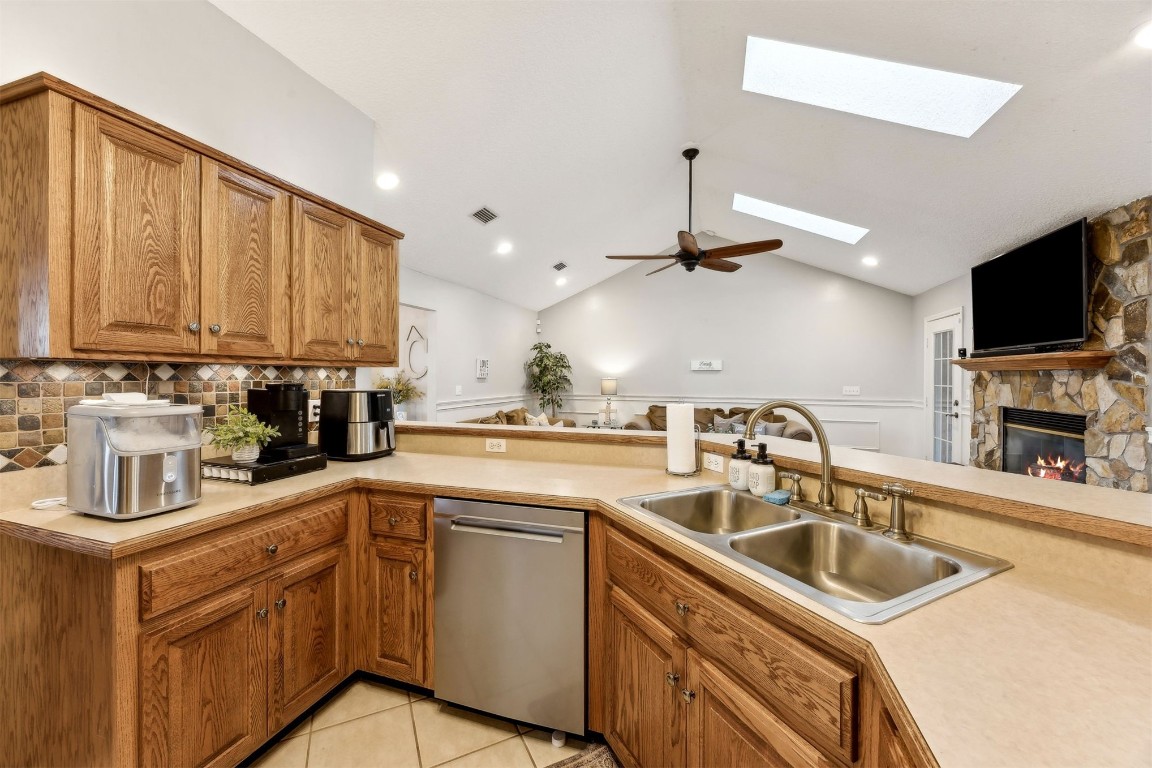 97535 Pirates Point Road Yulee, FL 32097 - Photo 24 of 59 a kitchen that has a sink and a stove top oven