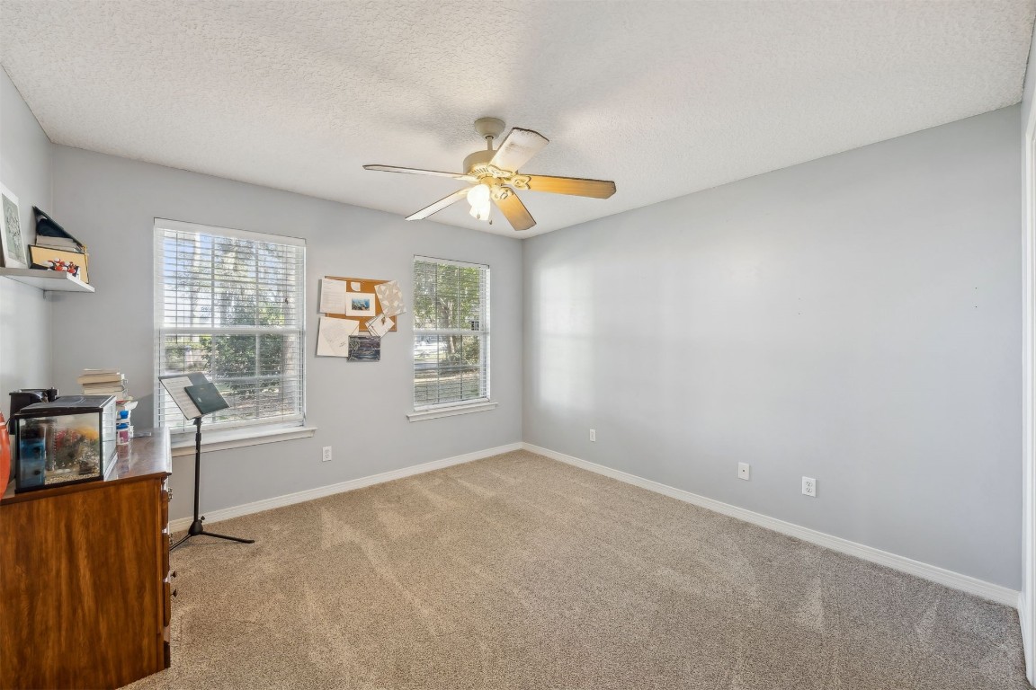 97535 Pirates Point Road Yulee, FL 32097 - Photo 34 of 59 a view of a workspace with furniture and a window
