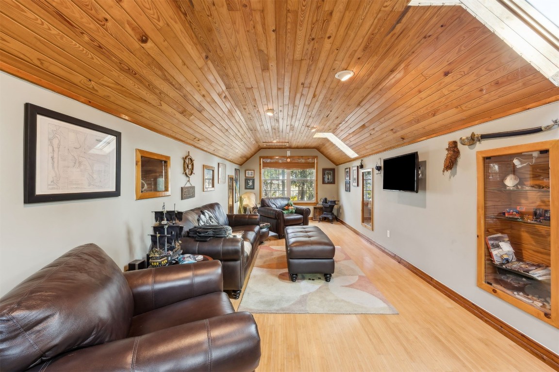 97535 Pirates Point Road Yulee, FL 32097 - Photo 47 of 59 a living room with furniture and a flat screen tv