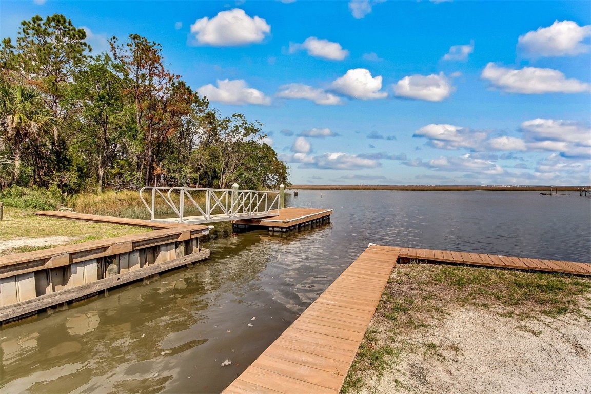 97535 Pirates Point Road Yulee, FL 32097 - Photo 57 of 59 a view of a swimming pool with an outdoor seating