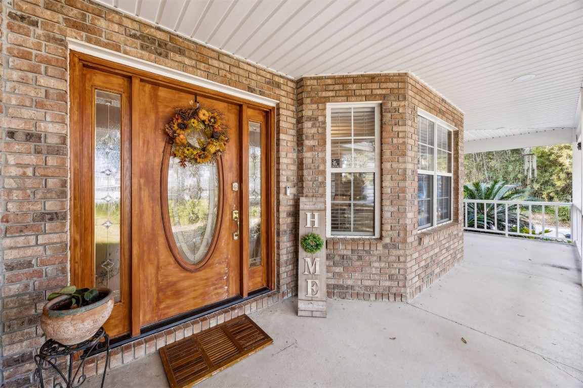 97535 Pirates Point Road Yulee, FL 32097 - Photo 6 of 59 a view of a livingroom with furniture and garden