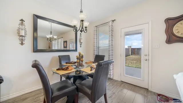 a dining room with furniture and window
