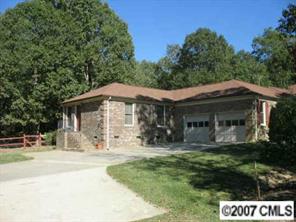3105 Gilboa Road Wingate, NC 28174 - Photo 2 of 8 a front view of a house with a yard