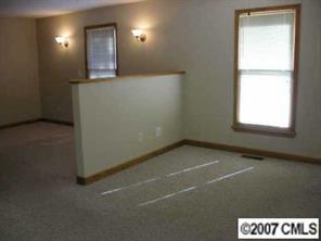 3105 Gilboa Road Wingate, NC 28174 - Photo 5 of 8 a view of an empty room and window