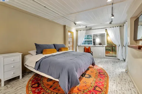 a bedroom with bed and window