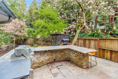 a view of backyard with a table and chairs
