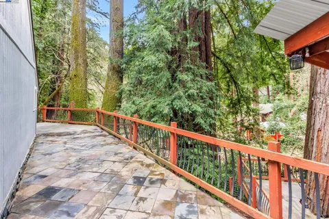 a view of a balcony with wooden stairs