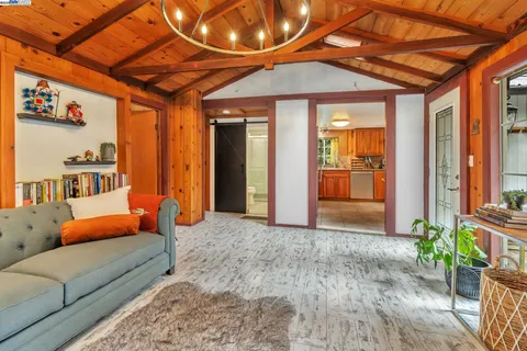 a outdoor space with the couches and potted plants